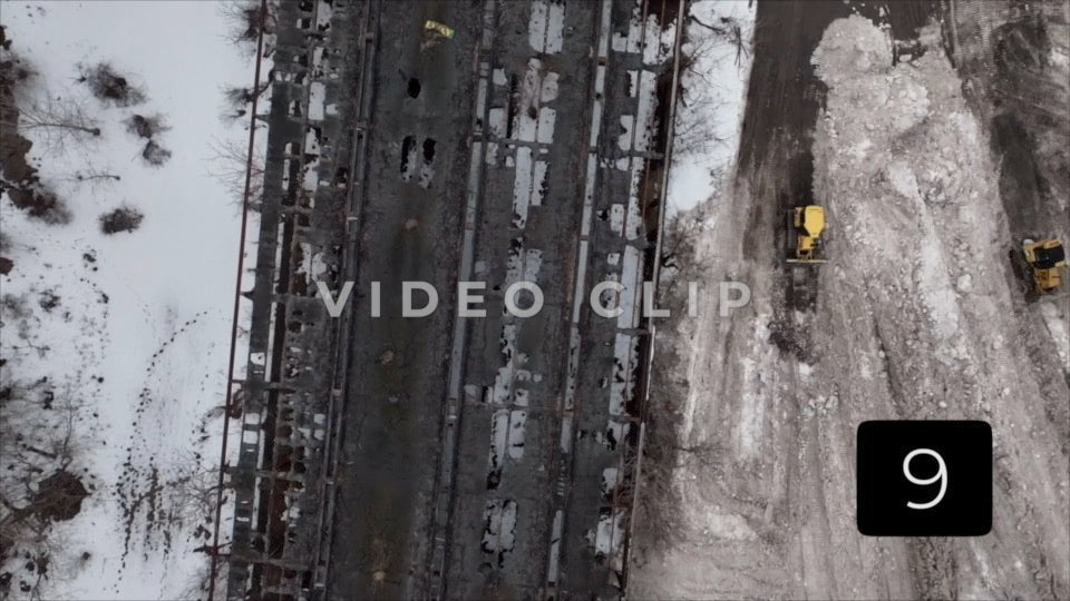 CLIP 9 - Buffalo, NY construction tractor plows snow beside abandoned building after winter storm