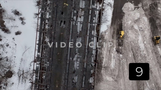 CLIP 9 - Buffalo, NY construction tractor plows snow beside abandoned building after winter storm