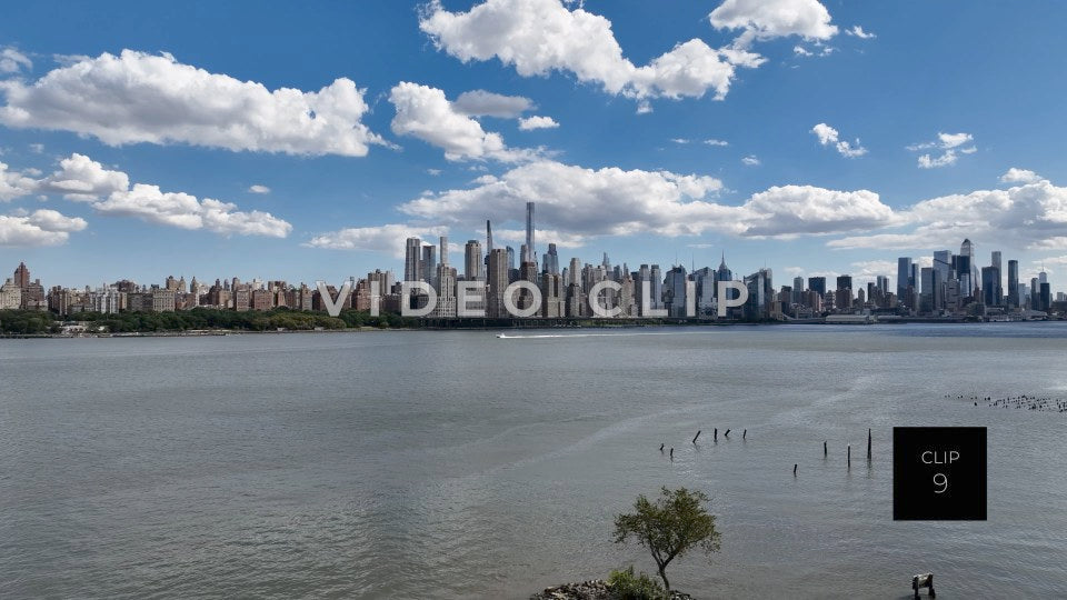 CLIP 9 - New York, NY motor boat cruising on Hudson river past city skyline