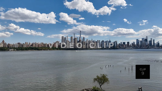CLIP 9 - New York, NY motor boat cruising on Hudson river past city skyline