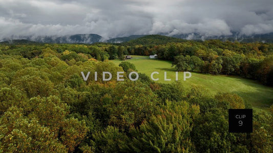 CLIP 9 - Ohiopyle, PA treetop flying towards homestead as clouds pass low over mountain top