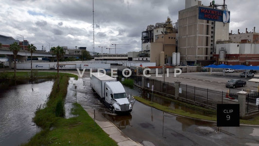 CLIP 9 - Jacksonville, FL truck drives through flooded street past Maxwell Coffee factory