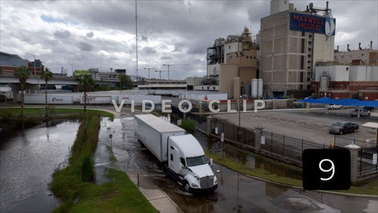 CLIP 9 - Jacksonville, FL truck drives through flooded street past Maxwell Coffee factory