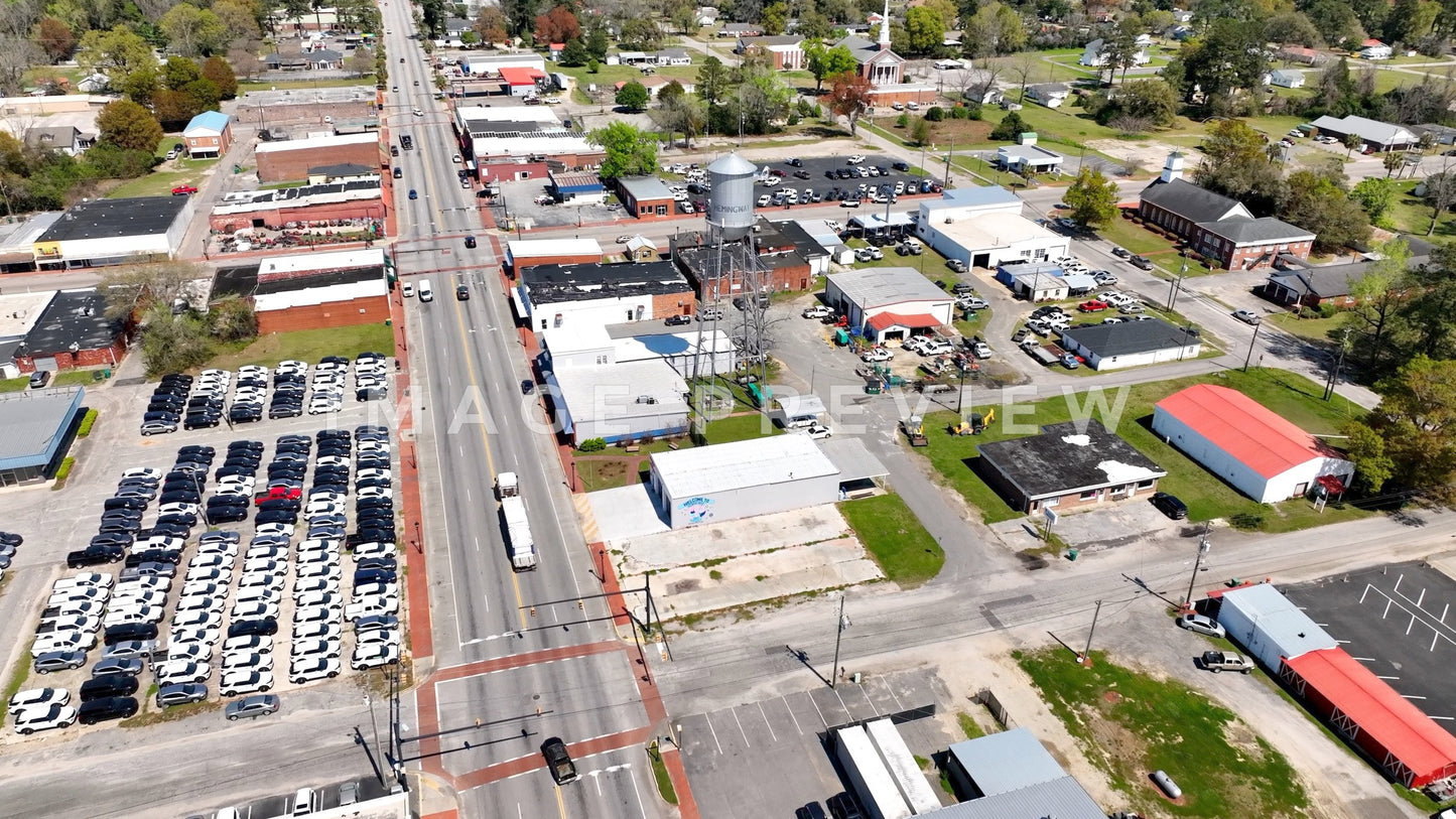 4k Still Frame - Hemingway, SC truck driving through downtown past old watertower