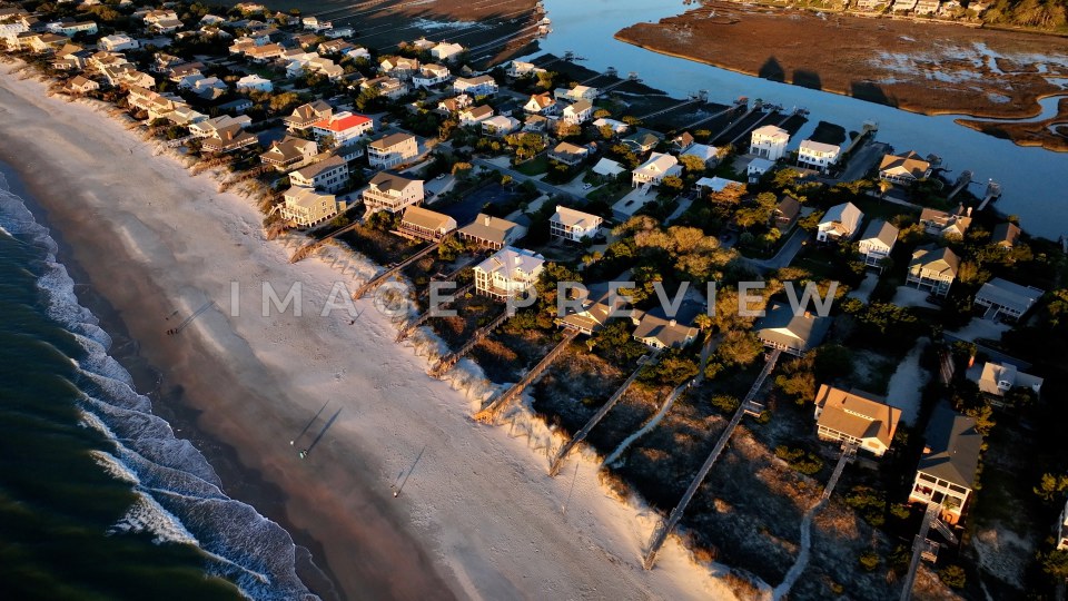 4k Still Frame - Pawleys Island, SC aerial walking along the coastline with view of beach houses
