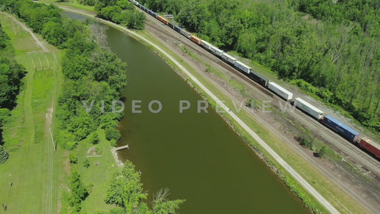 Video - Train passing by Erie Canal with people walking on trail in Fairport New York