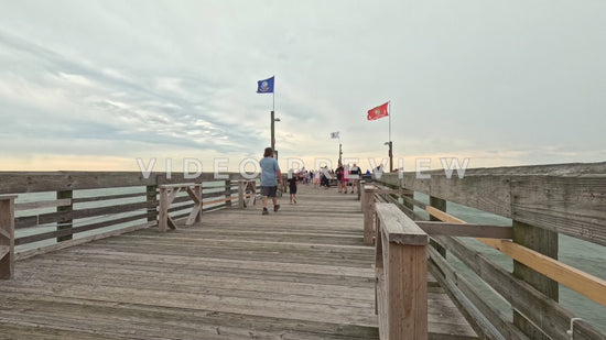 stock video timelapse people walking on fishing pier