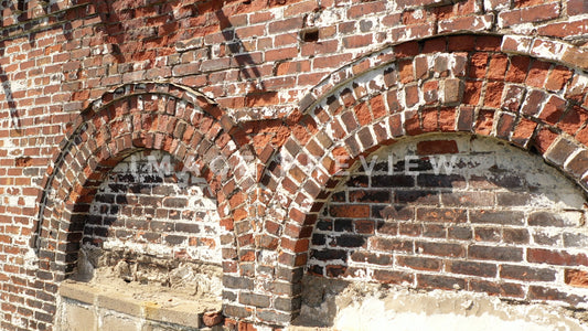 stock photo crumbling brick on old buidling