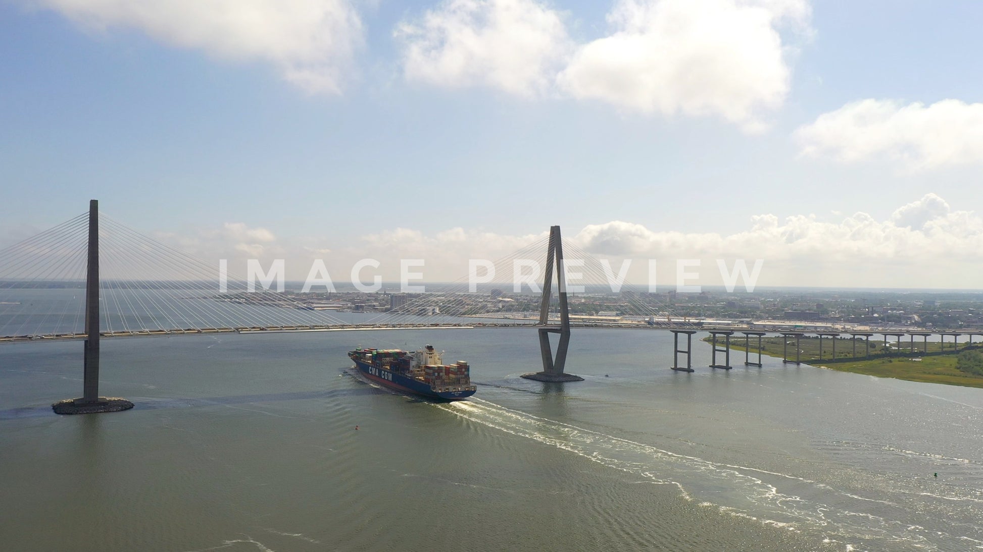 stock photo charleston sc cargo ship under bridge