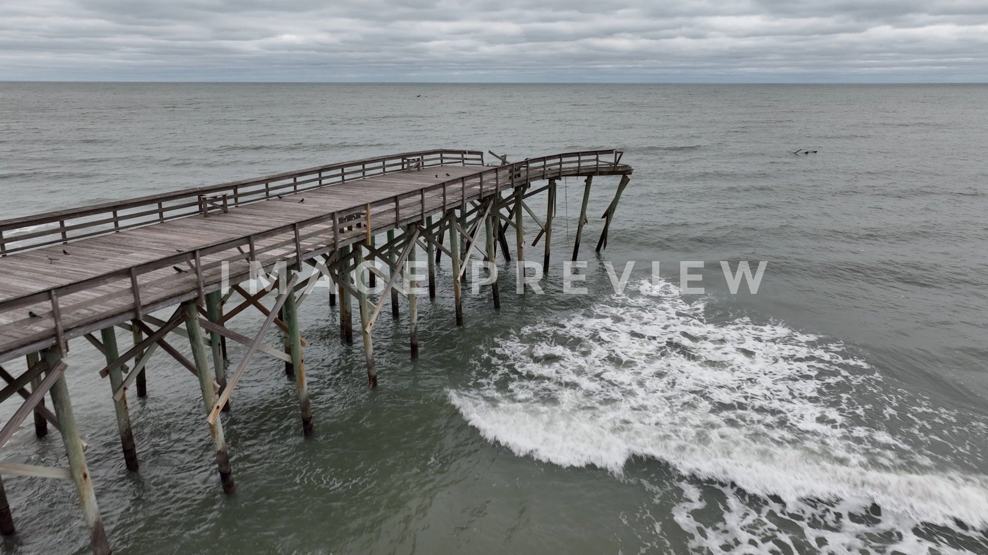 stock photo hurricane IAN damage to fishing pier in Pawleys island SC