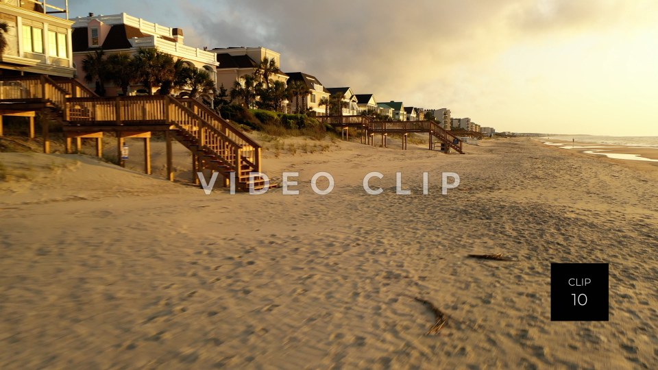 CLIP 10 - Litchfield Beach, SC beach front homes cast in golden morning light