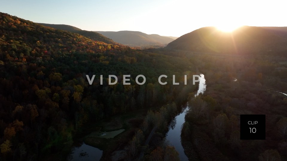 CLIP 10 - Tioga Dam and Reservoir, PA sun setting behind mountain with creek below