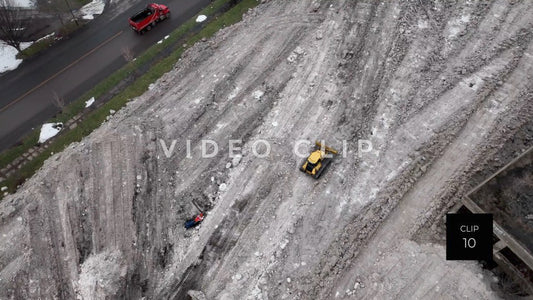 CLIP 10 - Buffalo, NY construction machinery plows snow gathered from city streets