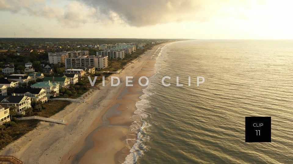 CLIP 11 - Litchfield Beach, SC aerial looking down the shoreline with homes and hotels during beautiful morning