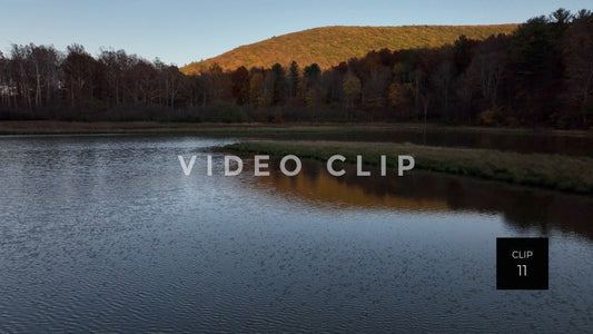 CLIP 11 - Tioga Dam and Reservoir, PA rising up over wetland to reveal mountain