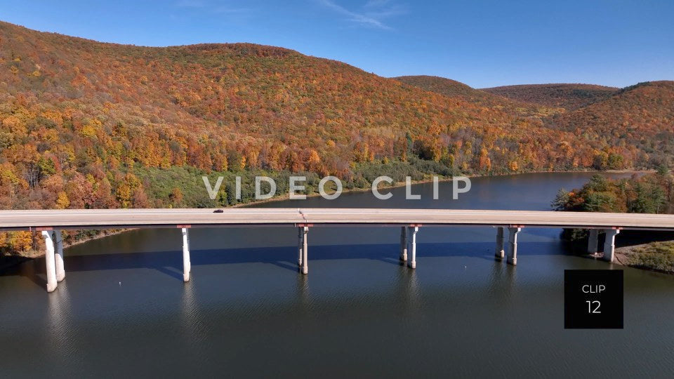 CLIP 12 - Tioga Dam and Reservoir, PA cars traveling over reservoir with mountains