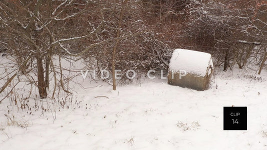 CLIP 14 - Hay bail in pasture covered in freshly fallen snow during Winter