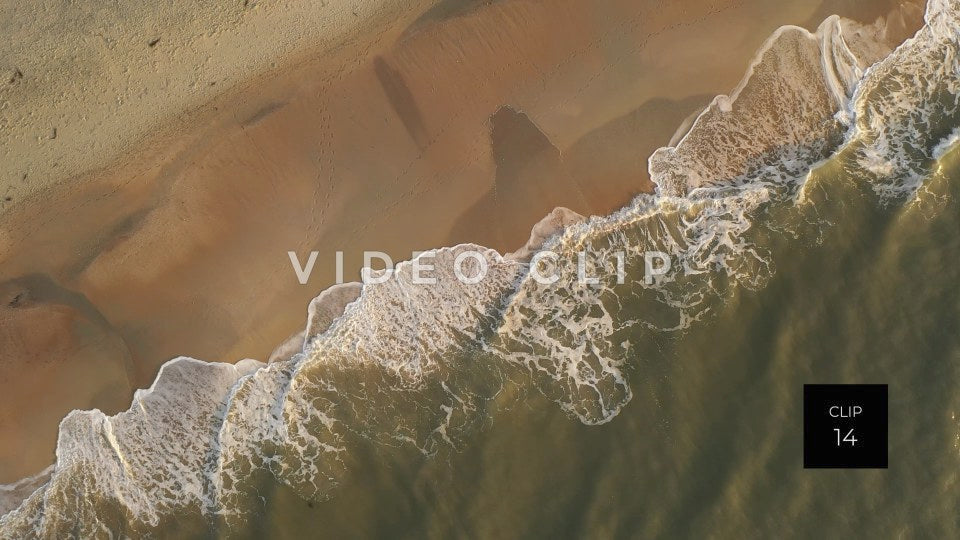 CLIP 14 - Litchfield Beach, SC looking down as waves break on the sandy shore during morning