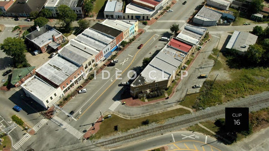 CLIP 16 - Montezuma, GA flight over downtown buildings and streets with light traffic