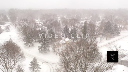 CLIP 16 - Winter snow storm covers small town neighborhood