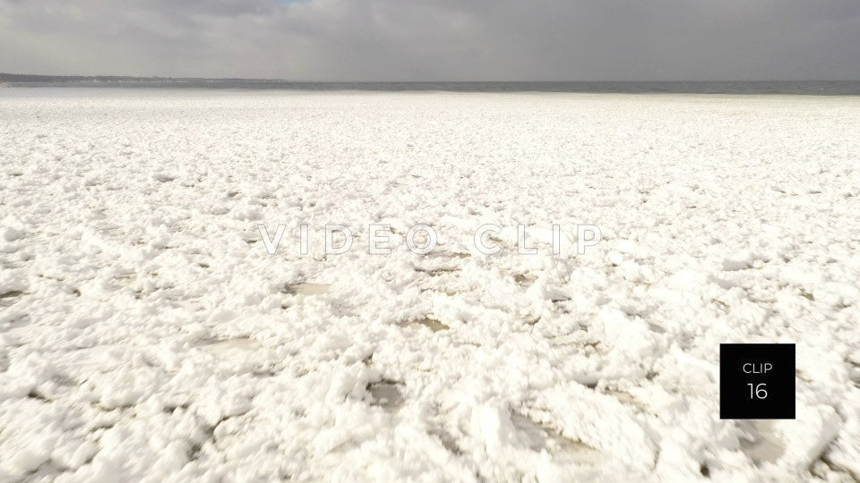 CLIP 16 - Winter Lake Ontario flying over pancake ice formations alone the shoreline