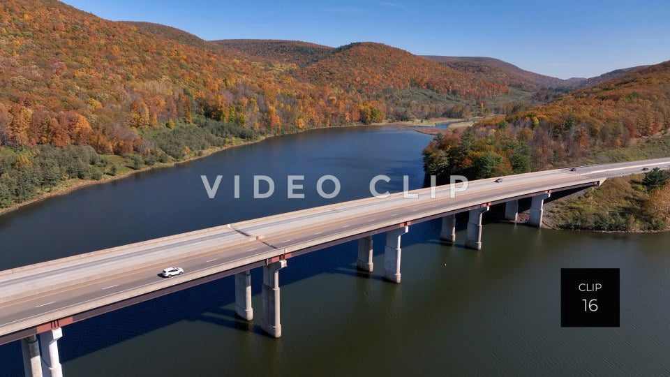 CLIP 16 - Tioga Dam and Reservoir, PA flying over bridge as cars drive over reservoir