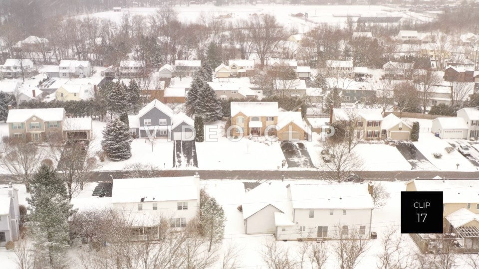 CLIP 17 - Small town neighborhood covered in snow during Winter freeze