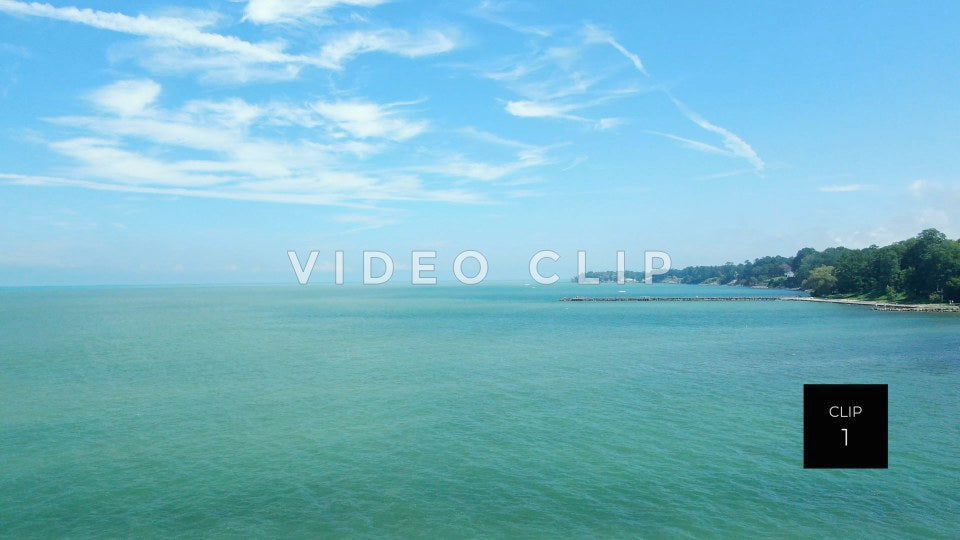 CLIP 1 - Lake Ontario Webster, NY rising up over water as boats pass