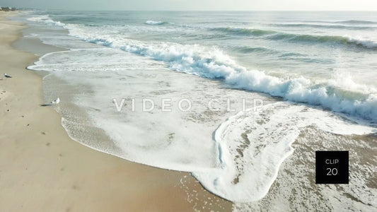 CLIP 20 - Litchfield Beach, SC low flight over breaking wave in morning sunlight