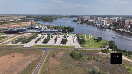 CLIP 2 - Wilmington, NC Battleship North Carolina beside Cape Fear River with city skyline