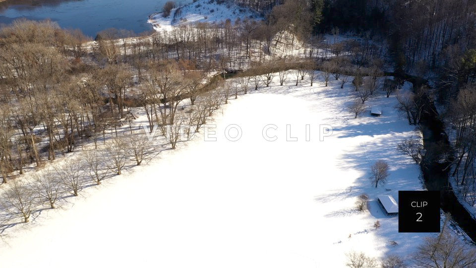 CLIP 2 - Snow covered field in Winter in Ellison Park, NY with tree orchard