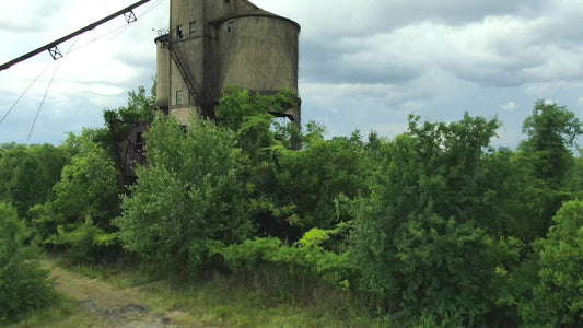 Video - Macon, Georgia flying above factory ruin to see town with approaching thunderstorm