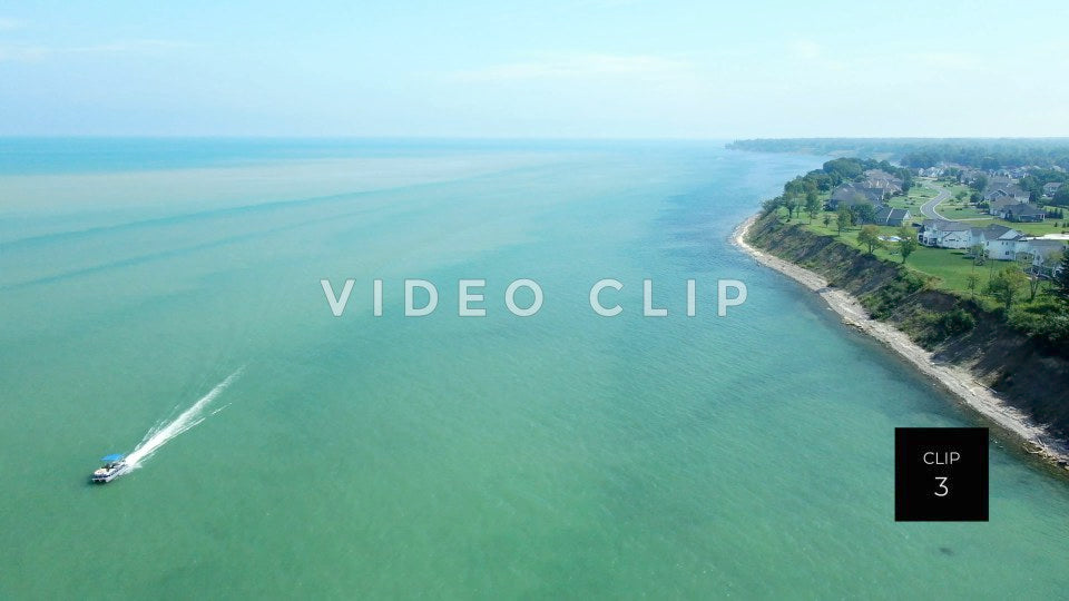 CLIP 3 - Lake Ontario Webster, NY boat passing by homes on lakeshore