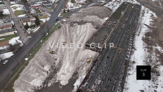 CLIP 3 - Buffalo, NY aerial view of snow mountain created by city workers after clearing streets