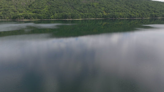 Video - Timelapse - Cloud reflections in water as camera rises above Hemlock Lake, NY