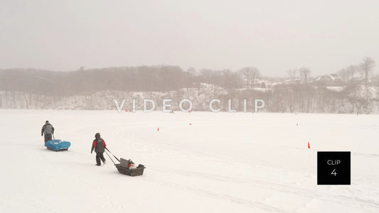 CLIP 4 - Winter father and son walking on frozen Irondequoit Bay to ice fish