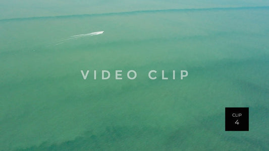 CLIP 4 - Lake Ontario Webster, NY rising up over water as single boat passes by