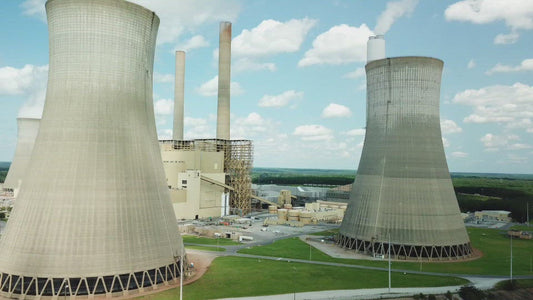 Video - Massive smoke stacks releasing harmful emissions into the atmosphere at coal fired power plant Scherer