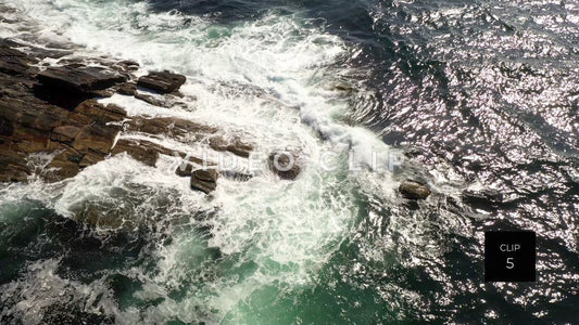 CLIP 5 - Maine Coast looking down on ocean waves breaking on rocks