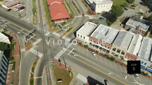 CLIP 5 - Montezuma, GA cars driving through intersection beside train depot