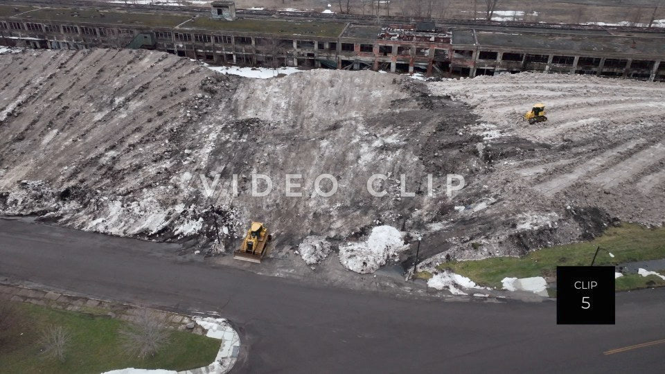 CLIP 5 - Buffalo, NY snow mountain created by city workers after clearing roadways