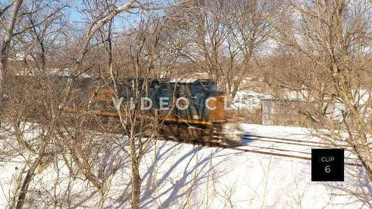 CLIP 6 - Train travels through snow covered Winter landscape