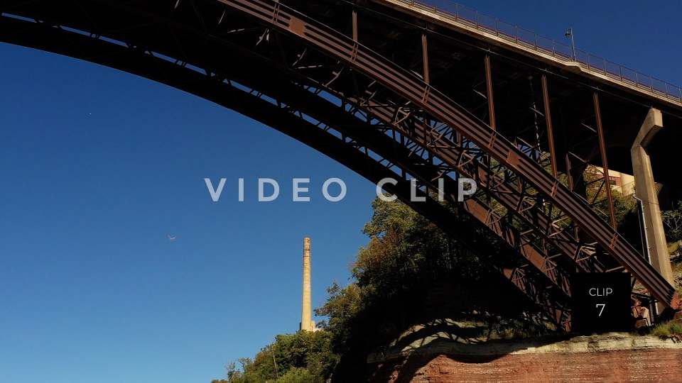 CLIP 7 - Rochester, NY seagull flies under arched bridge at Lower Falls Park