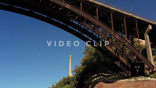 CLIP 7 - Rochester, NY seagull flies under arched bridge at Lower Falls Park