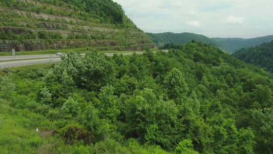 Video - Cars traveling on interstate highway through mountain pass in West Virginia