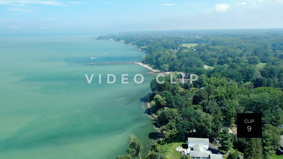 CLIP 9 - Lake Ontario Webster, NY aerial of coastline with trees and houses