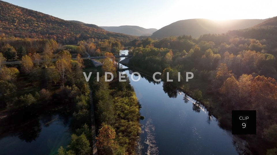 CLIP 9 - Tioga Dam and Reservoir, PA RV drives over bridge as the sun sets behind mountains