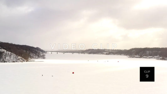 CLIP 9 - Winter frozen Irondequoit Bay with ice fisherman and bridge crossing