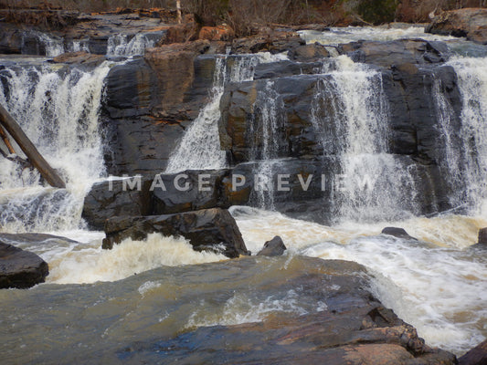 Photo - Waterfall over rocky shoals