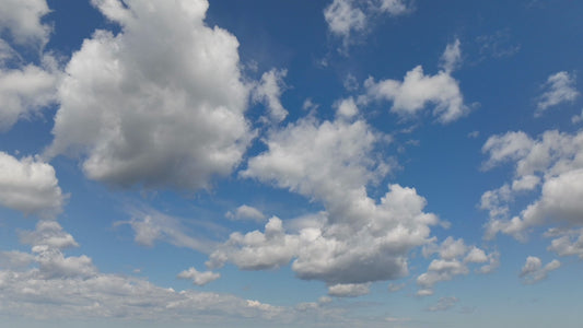 Video - Timelapse - Clouds passing overhead in blue sky